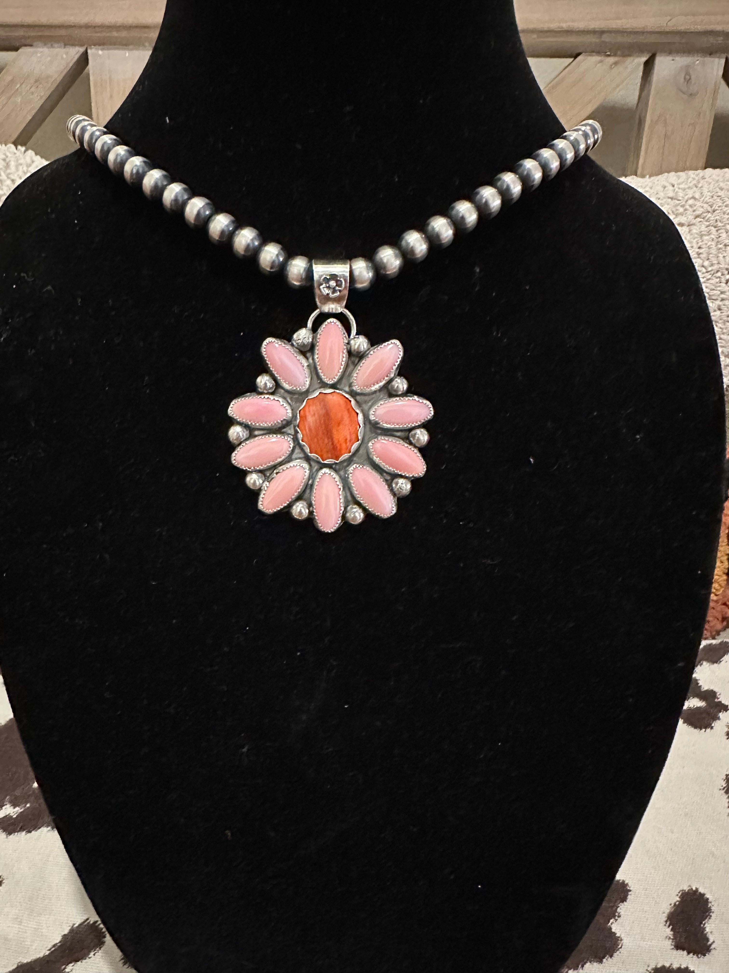 Pink conch statement pendant