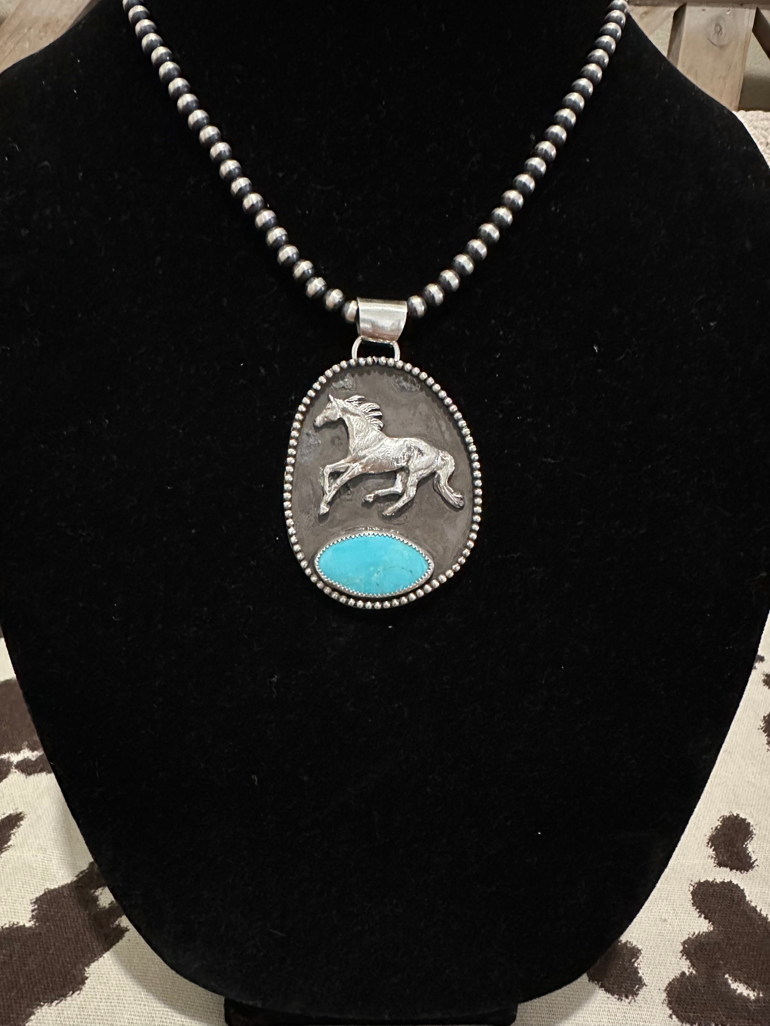 Running horse pendant